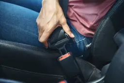 woman-hand-fastening-seatbelt-car-cropped-image-woman-sitting-car-putting-her-seat-belt-safe-driving-concept