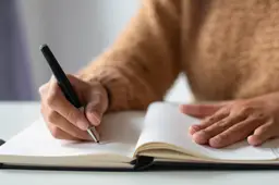 close-up-businesswoman-making-notes-personal-organizer