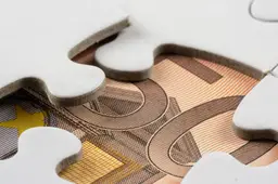 closeup-shot-part-money-seen-removed-piece-jigsaw-puzzle