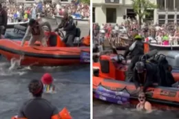 Amsterdam: Demonstranten springen in gracht tijdens Canal Gay Pride