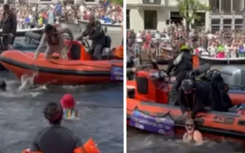 Amsterdam: Demonstranten springen in gracht tijdens Canal Gay Pride
