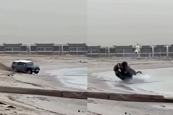 /video/man-doet-stoer-met-auto-op-strand-eindigt-huilend-in-zee