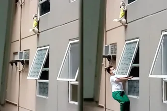 Aan flat hangend hondje gered in Filipijnse hoofdstad Manilla