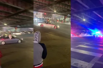 Auto's branden het rubber van hun banden op kruispunt in San Francisco