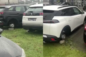 Dieven hebben wat banden geleend van auto's van een garage