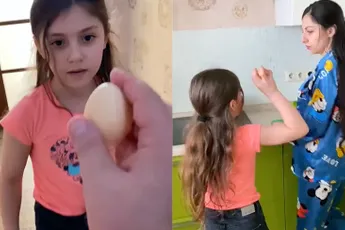 Vader van het jaar laat dochter een eitje tikken