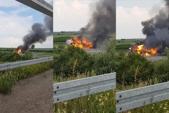 Vrachtwagen met spuitbusjes als lading staat in Servië in de hens
