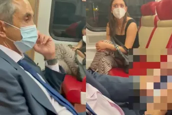 Viezerik betrapt op het maken van foto's onder rokje van vrouw in trein
