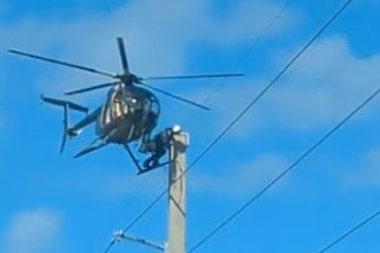 Helikopter voor elektromonteur bij Seven Mile Bridge