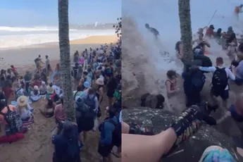 Publiek massaal nat pak tijdens surfwedstrijd Hawaii