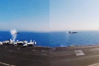 Super Hornet vliegt met supersonische snelheid langs vliegdekschip