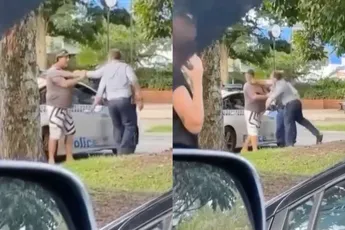 Agent deelt er even een uit aan Aussie die in zijn politieauto wil rondneuzen
