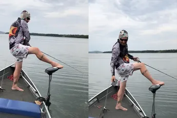 Visser kan vissen naar zijn telefoon