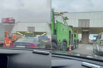 In Rusland kan alles, behalve een kiepwagen onder een viaduct doorduwen