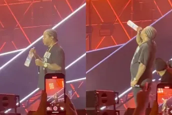 Rapper Xzibit klokt tijdens optreden in Moskou een fles wodka leeg