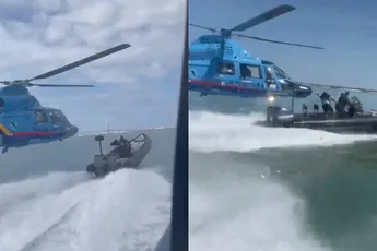 Ondertussen in de Baai van Cádiz: Helikopter zit achter boot vol witte sneeuw aan