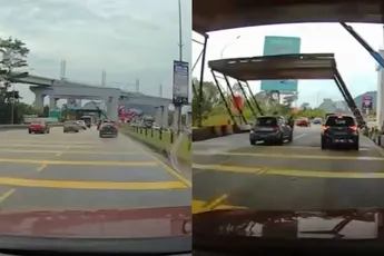 Bouwconstructie klettert op auto in KL, wonderbaarlijk kruipt vrouw door het oog van de naald