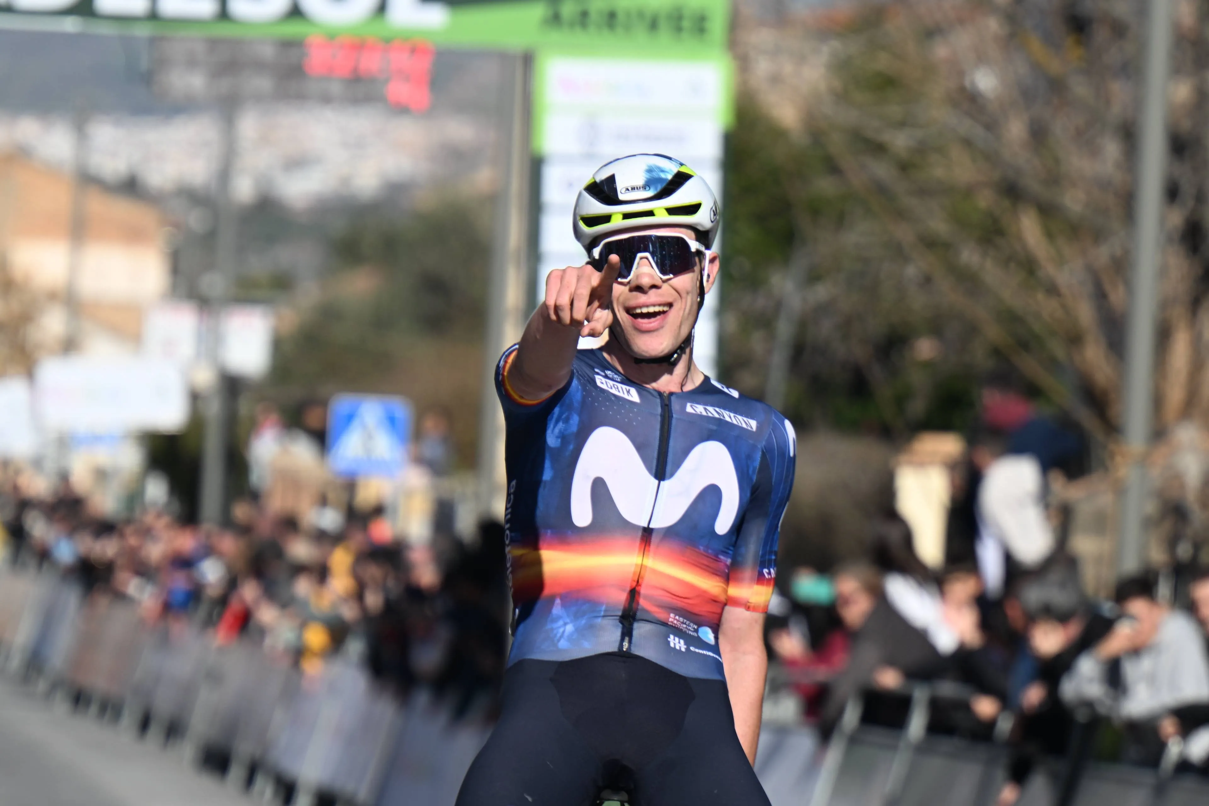 Ivan Romeo points to the camera in celebration as he wins stage 2 at the 2026 Vuelta a Andalucia