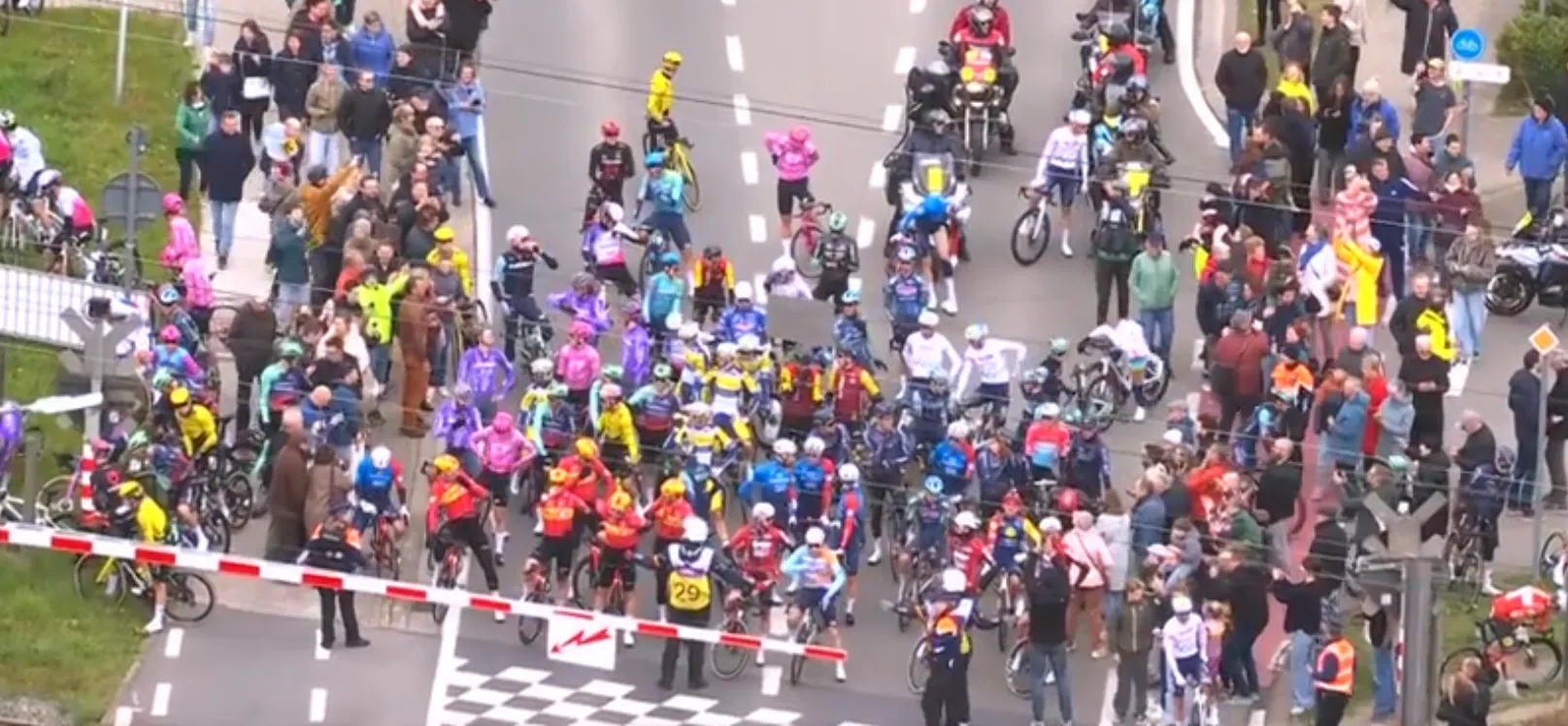VIDEO: Chaos at the Tour of Flanders! Peloton halted as half the bunch caught out behind a train