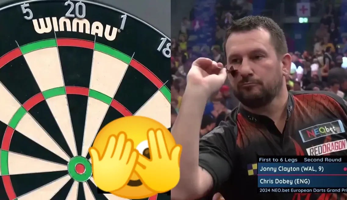 Jonny Clayton introduceert een nieuwe route vanaf 58 met twee pijlen in de hand