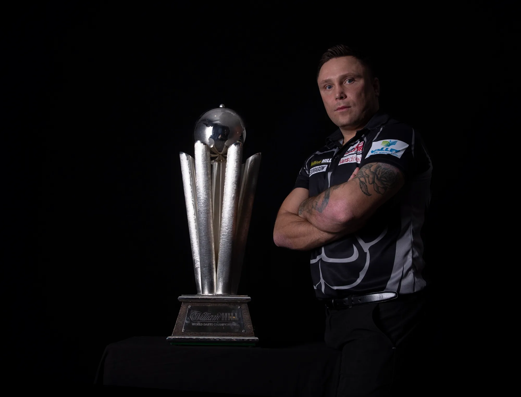 Price survives opening scare against Lewis at PDC World Darts Championship