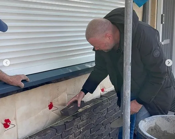 Van Barneveld works as bricklayer on repair work at home: 'Brick by brick we are getting to the final result'