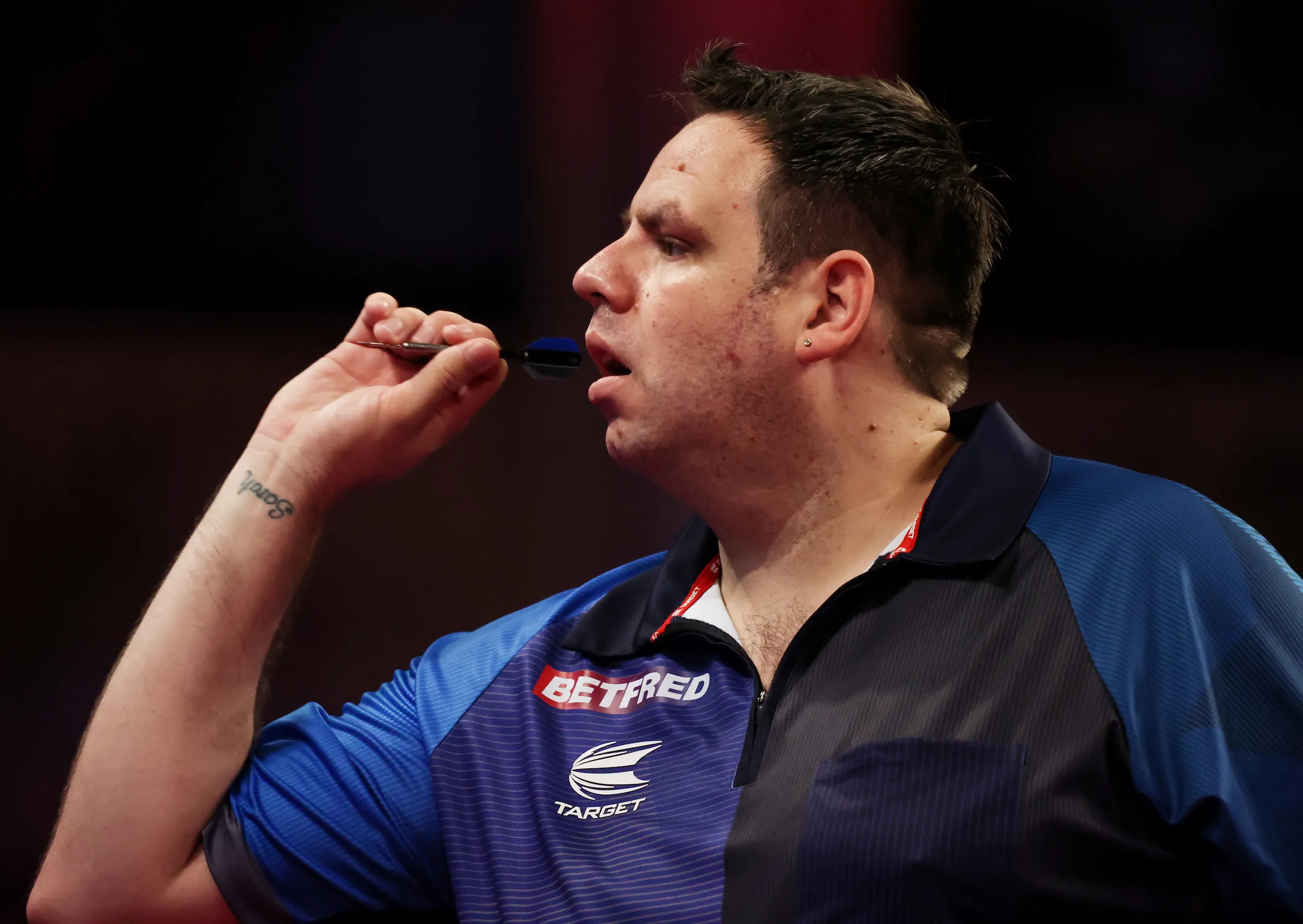 Lewis eases past Larsson to begin PDC World Darts Championship, set for Heta clash in second round