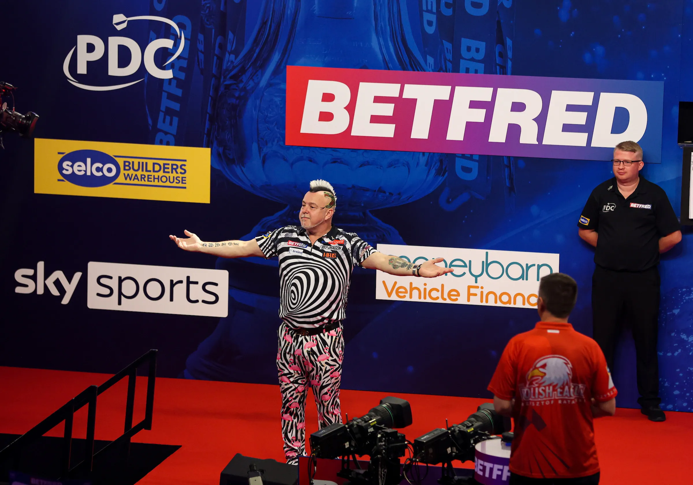 Defending champion Wright continues World Matchplay run after epic tie-break victory over Ratajski