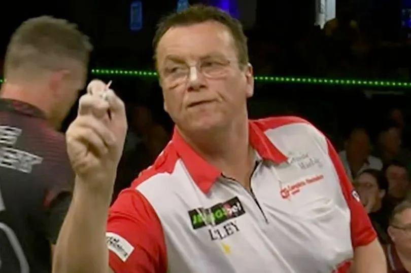 PHOTO: Large section of dartboard covered in chalk by Deller raises debate at World Seniors Darts Championship