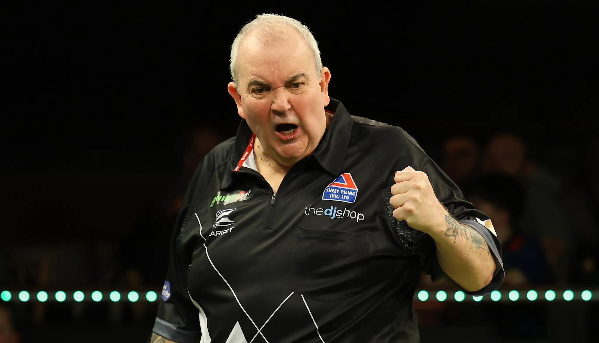 Taylor battles back to edge past McGarry in tie-break thriller at World Seniors Darts Championship