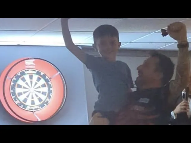 VIDEO: 7-year-old boy beats Clayton and goes all out at darts exhibition