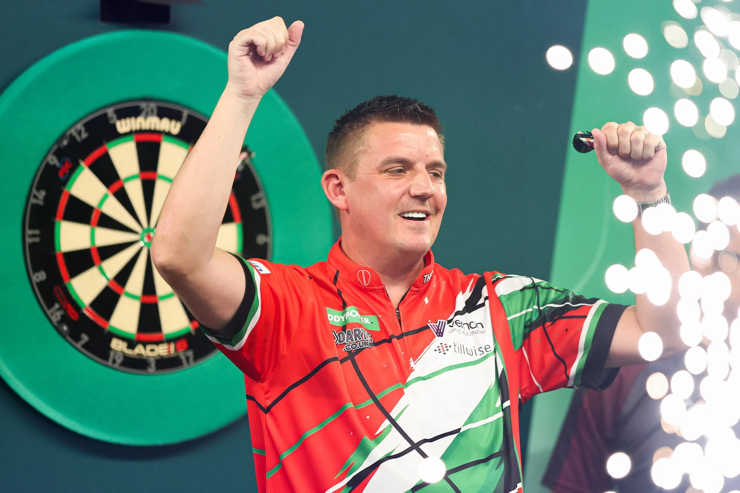 David Davies raises arm in celebration at PDC World Darts Championship.