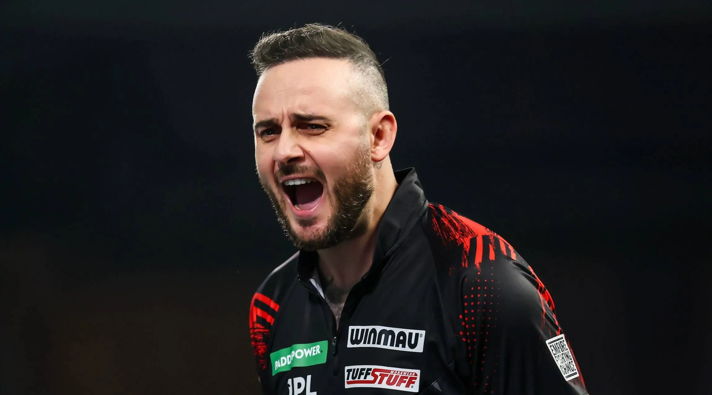 Joe Cullen screams on stage.