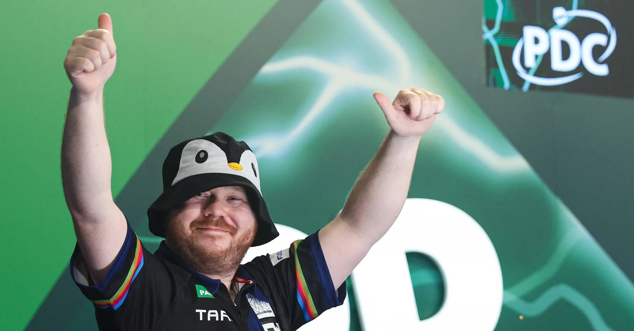 Justin Hood wears a penguin hat