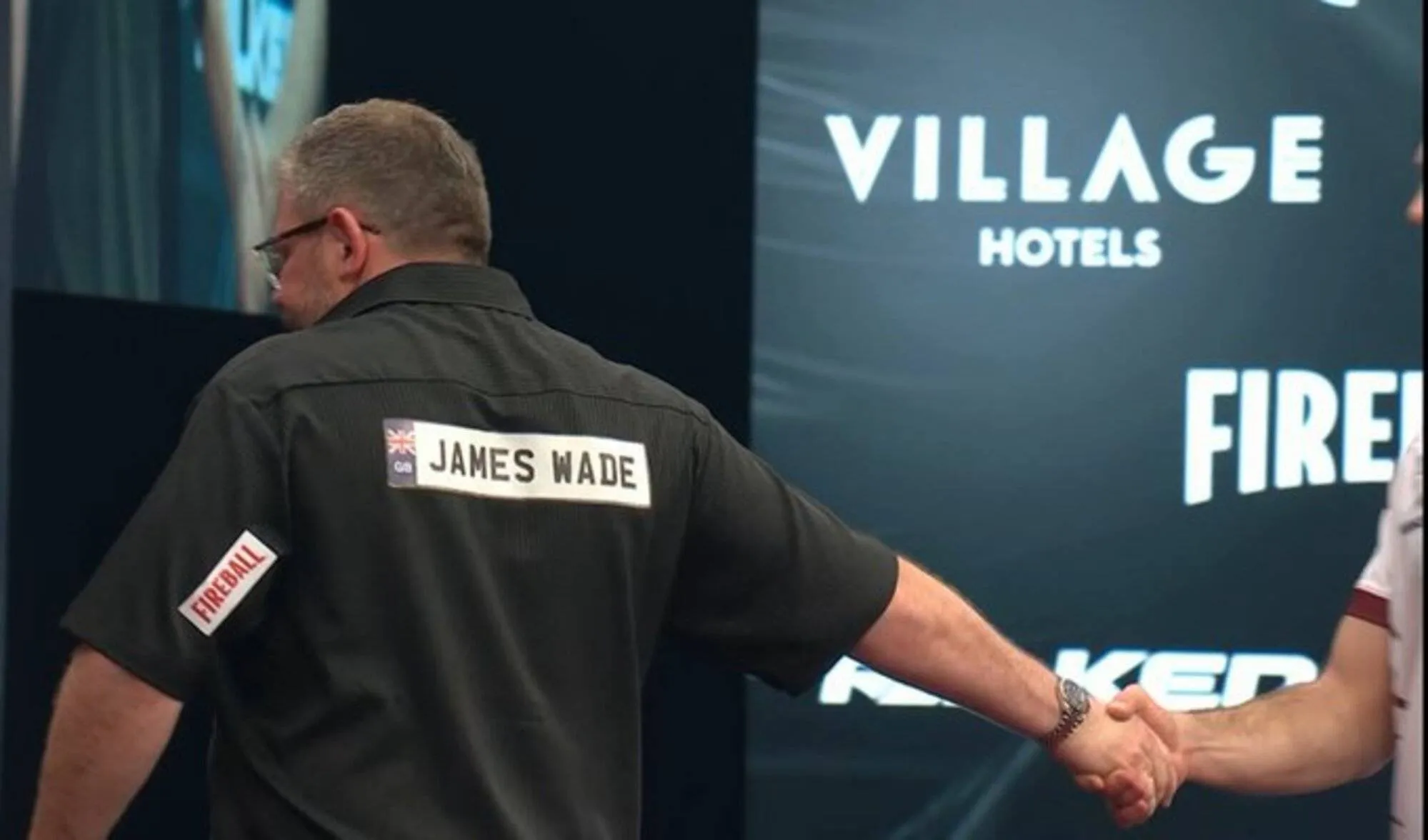 James Wade and Madars Razma share a frosty handshake after their match at the 2026 Winmau World Masters