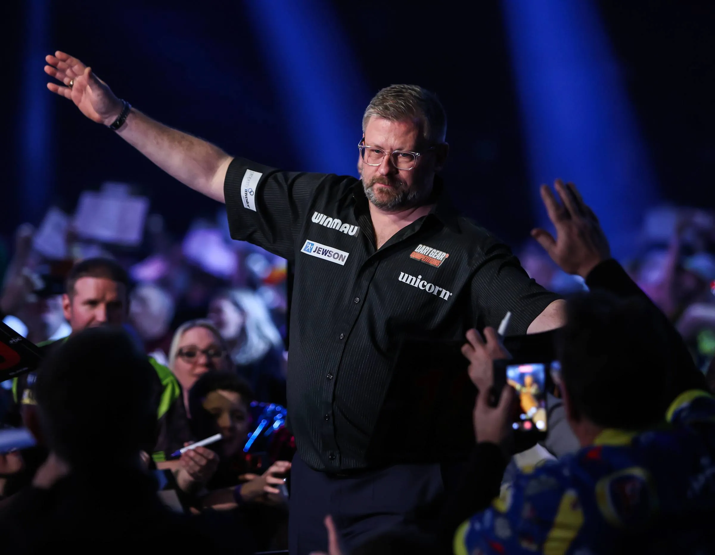 James Wade waves to crowd.