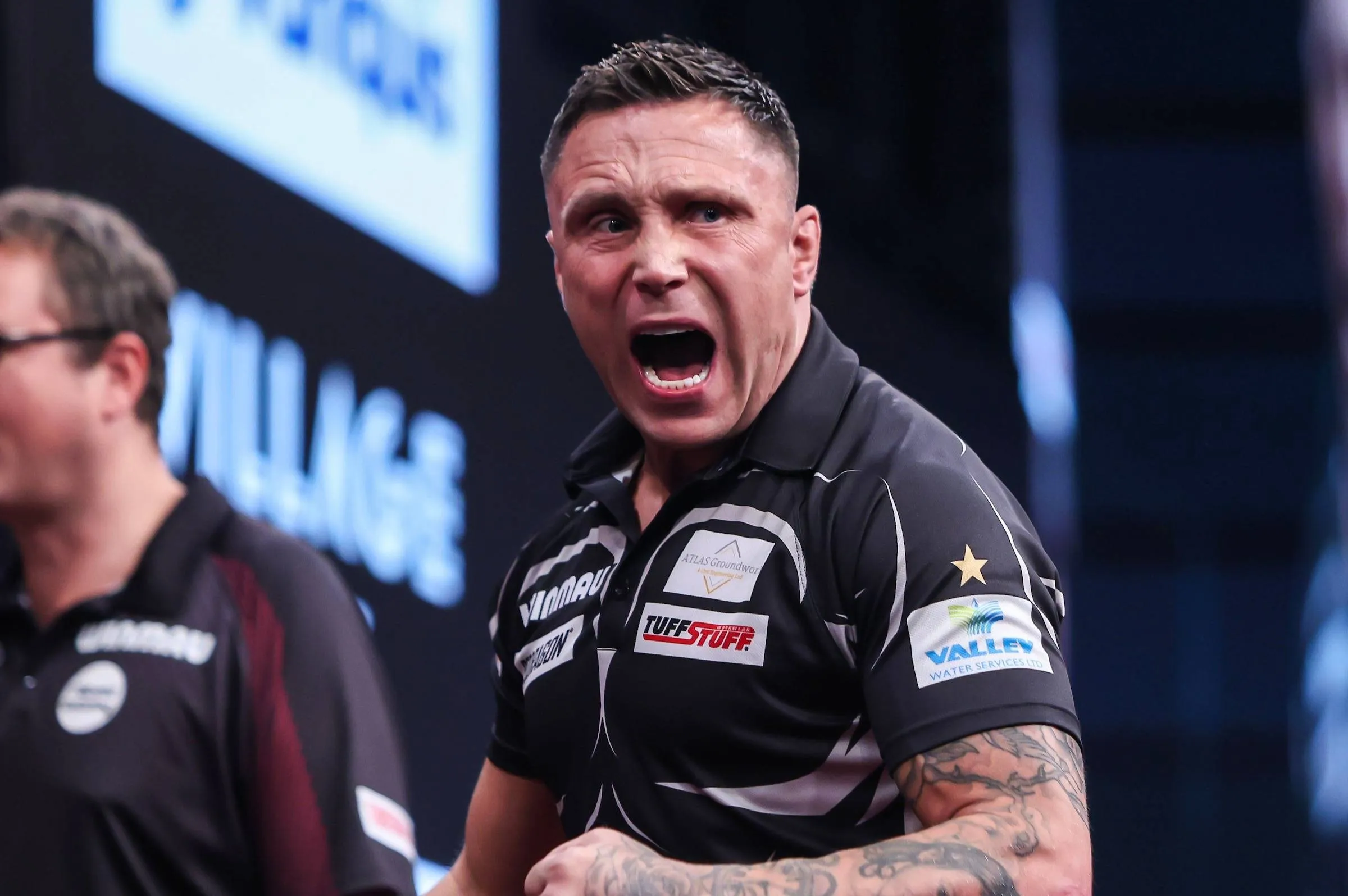 Gerwyn Price celebrating on stage