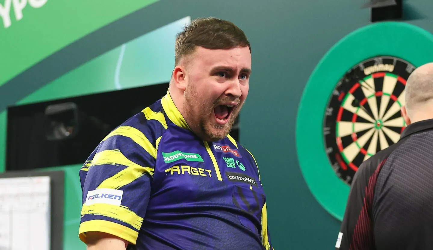 Luke Littler roars with his mouth wide open after hitting the Big Fish