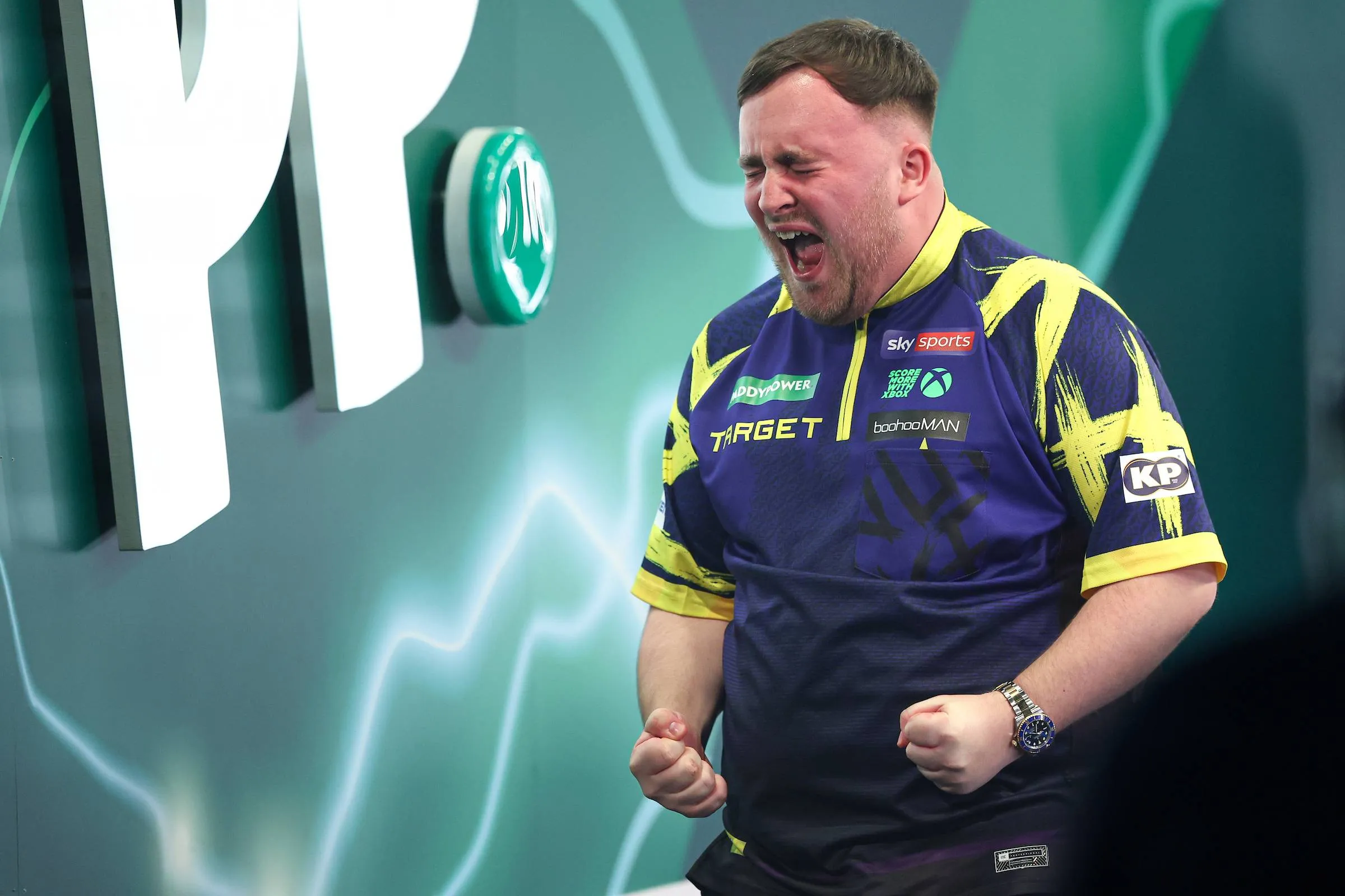 Luke Littler roars in celebration