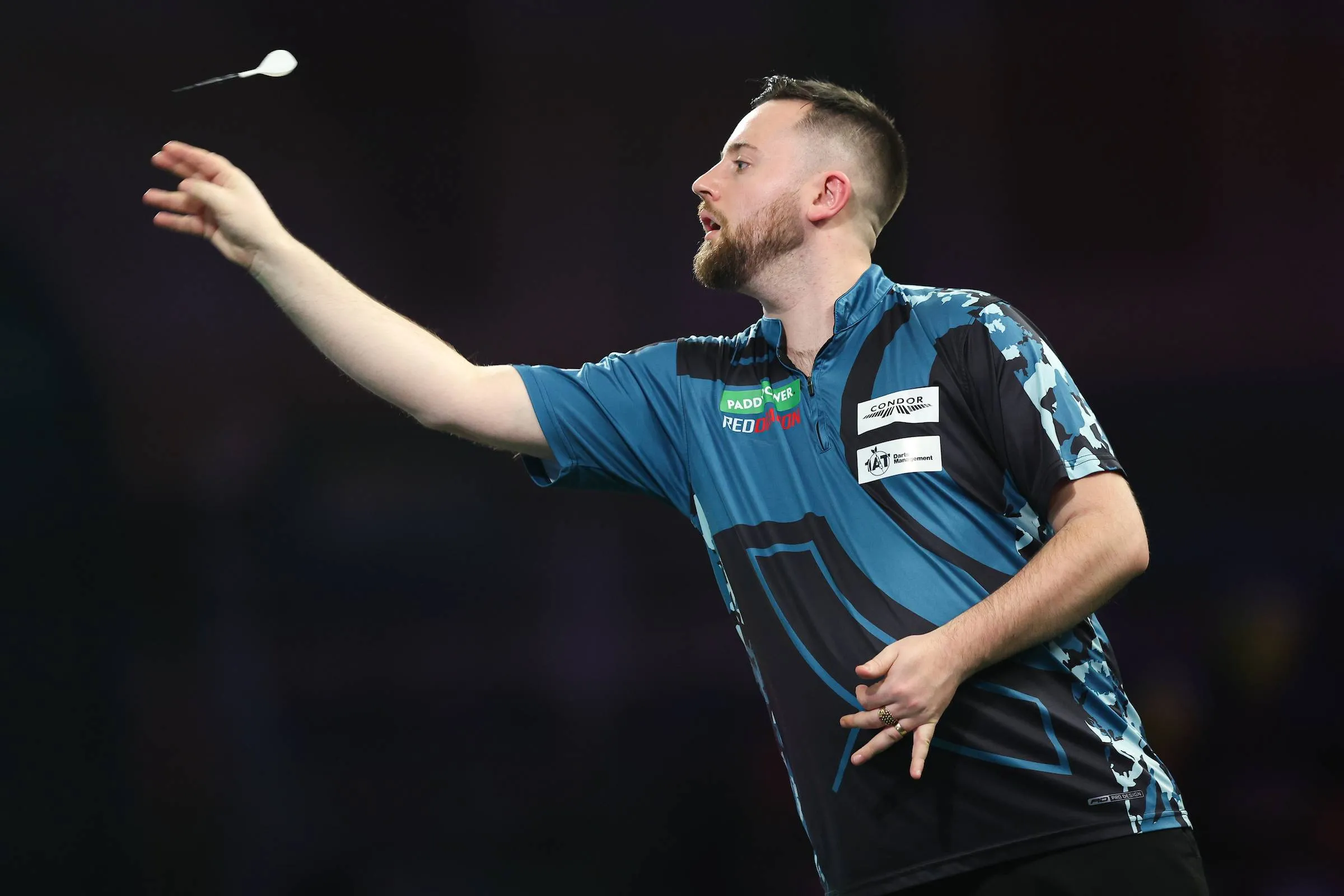 Connor Scutt throws his dart