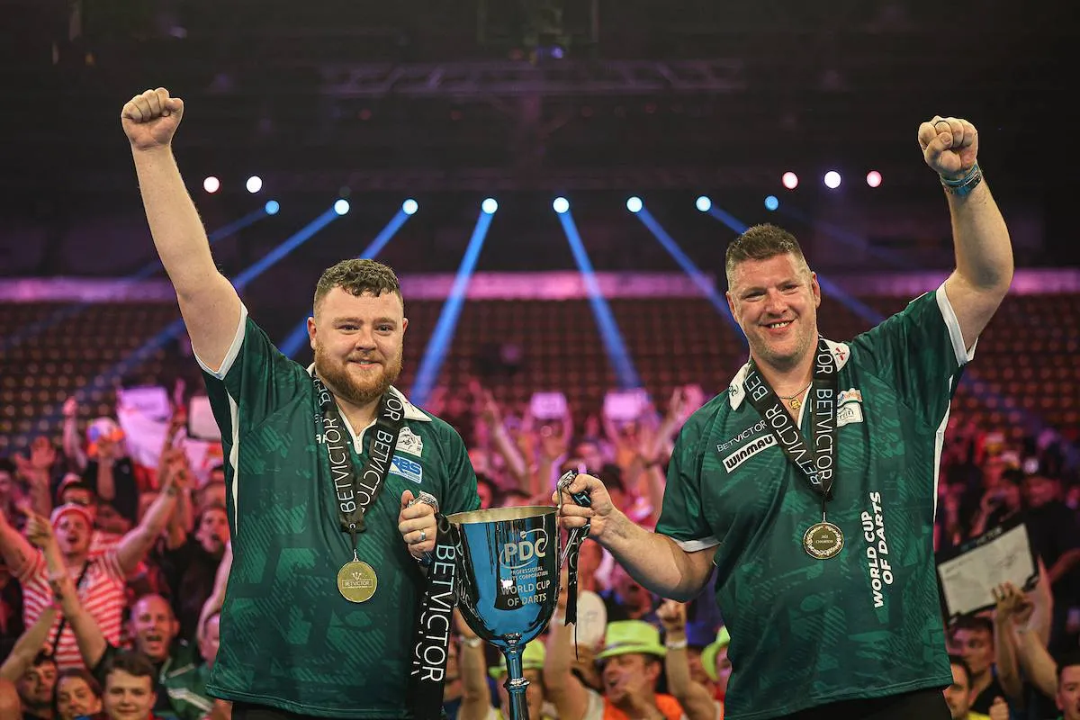 Josh Rock and Daryl Gurney show off their trophy at the 2025 World Cup of Darts