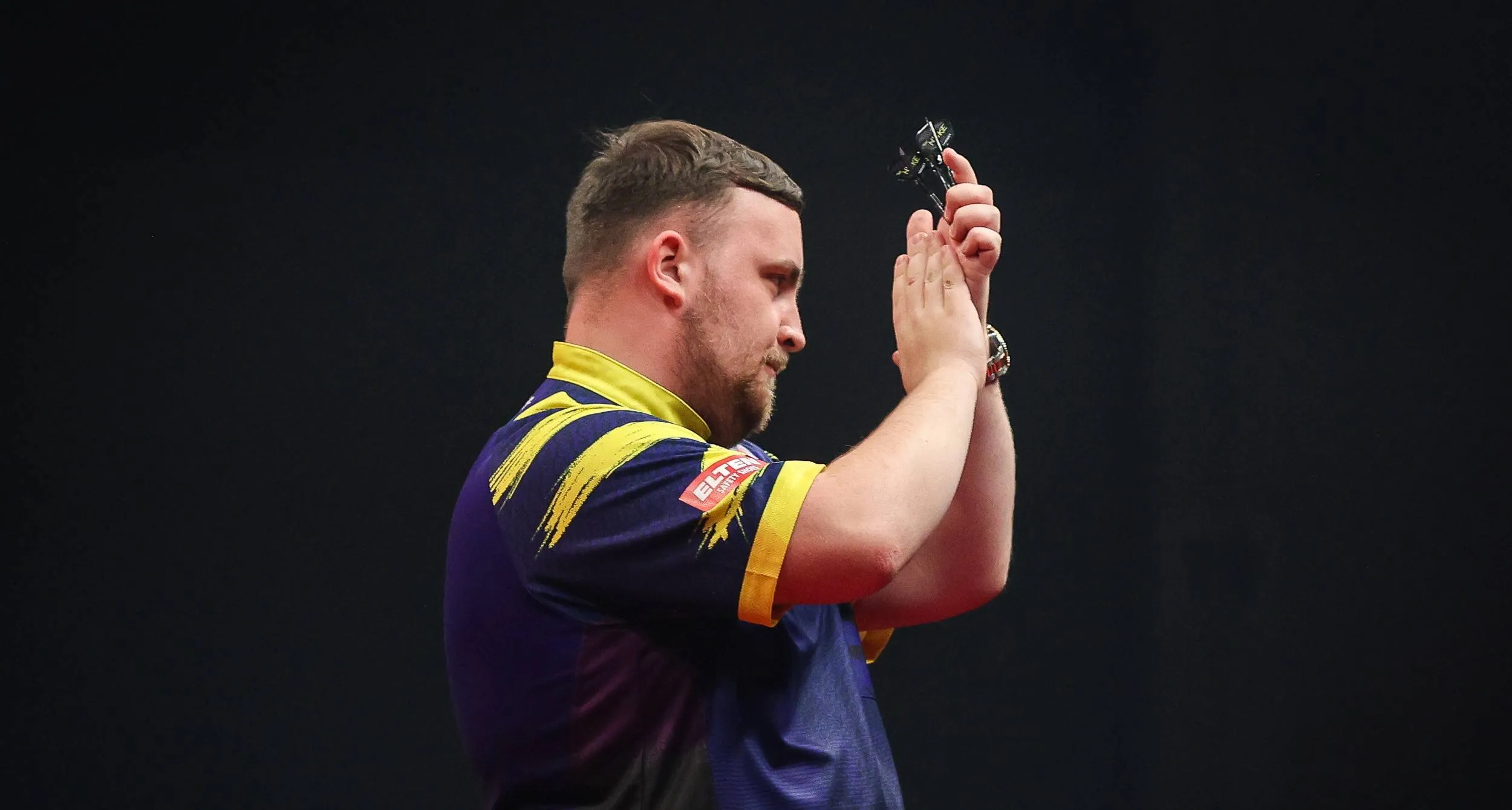 Luke Littler claps crowd