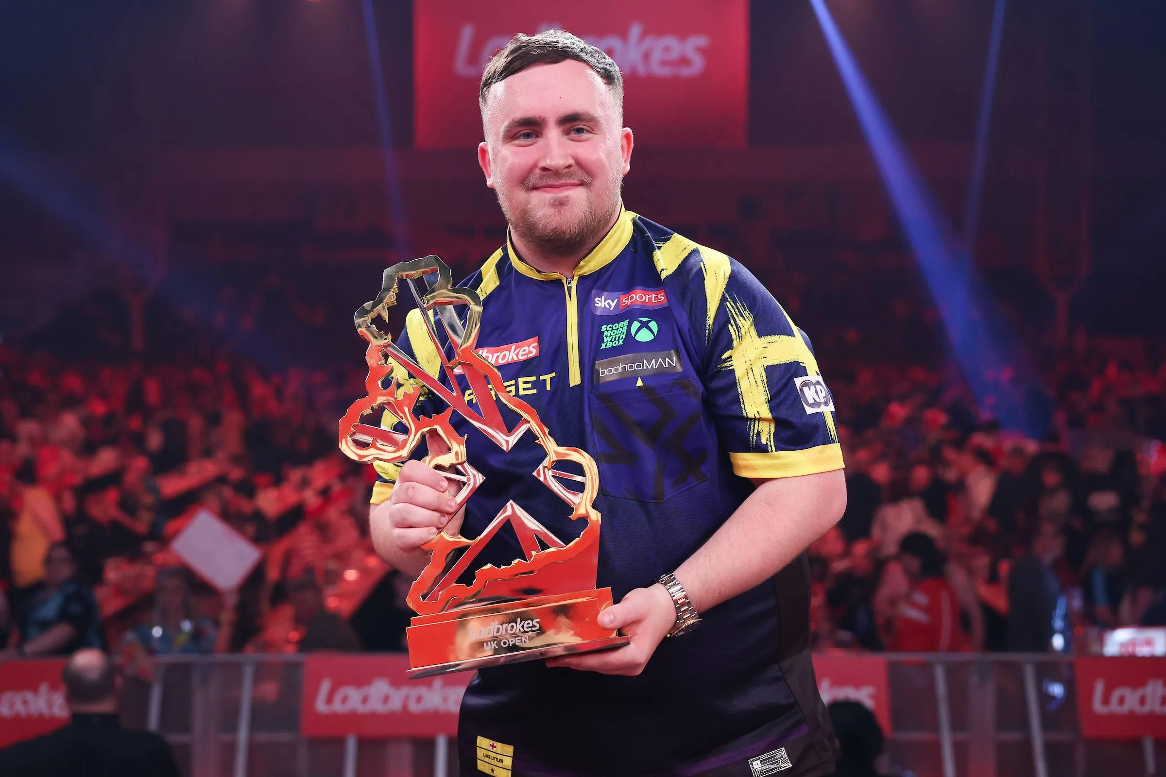 Luke Littler proudly poses with his UK Open trophy