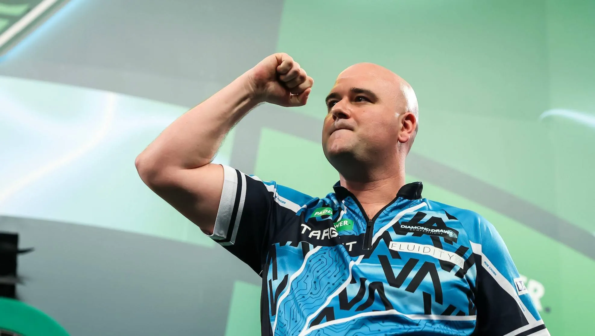 Rob Cross celebrates with a clenched fist