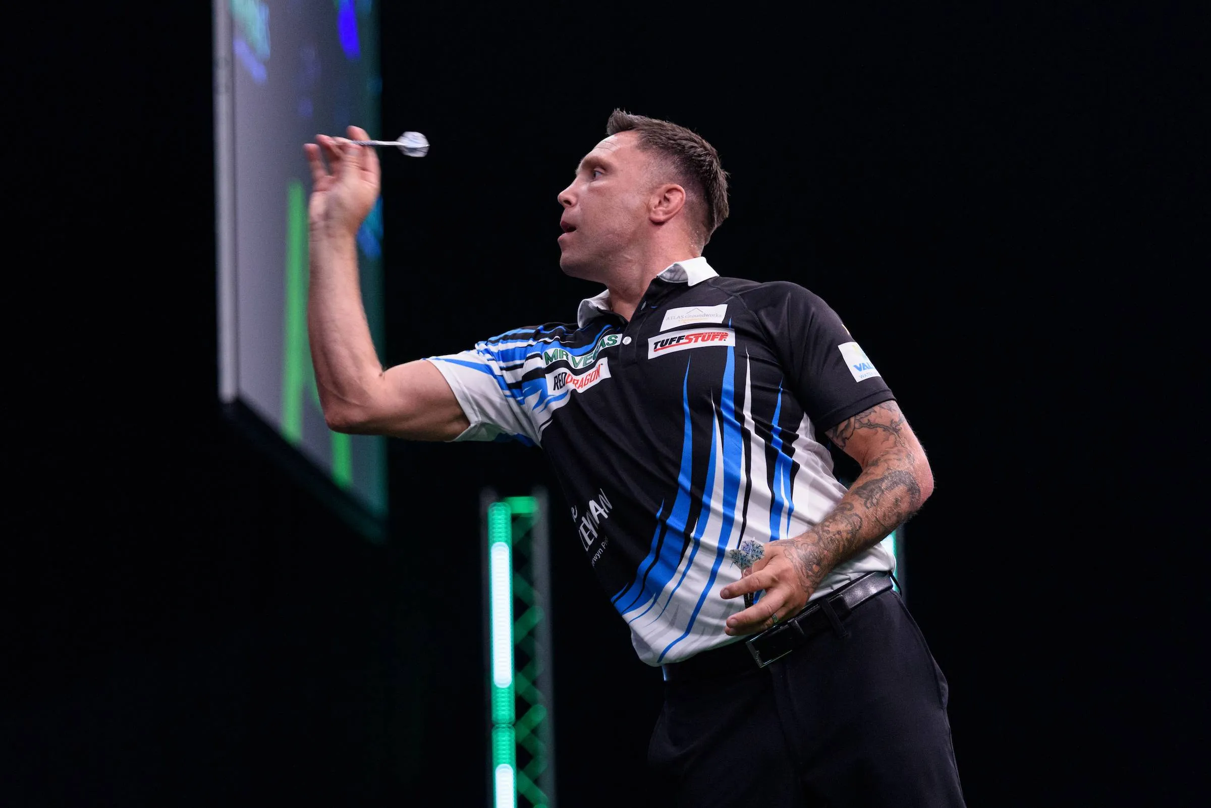 Gerwyn Price throws dart.