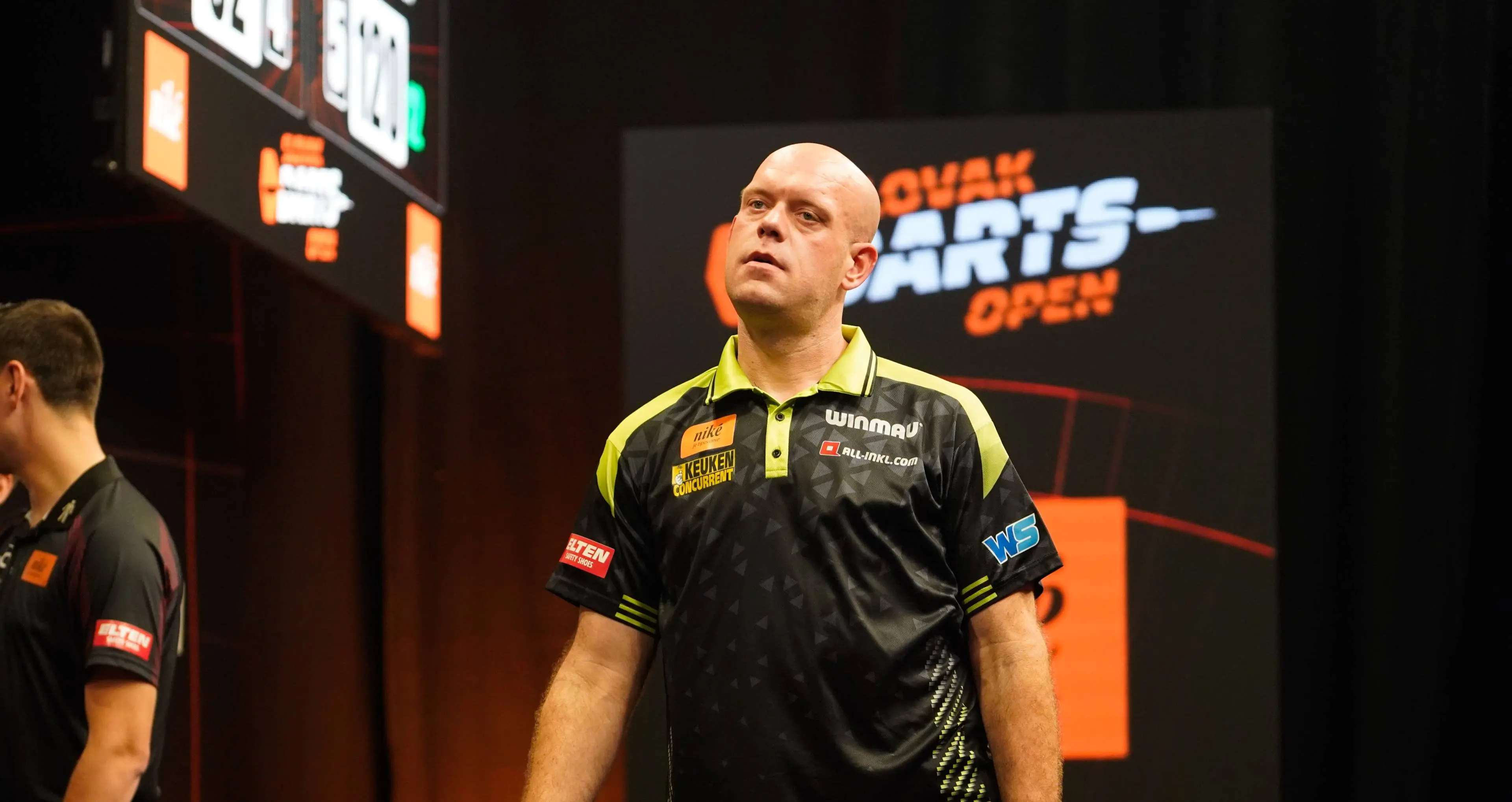 Michael van Gerwen looks on.