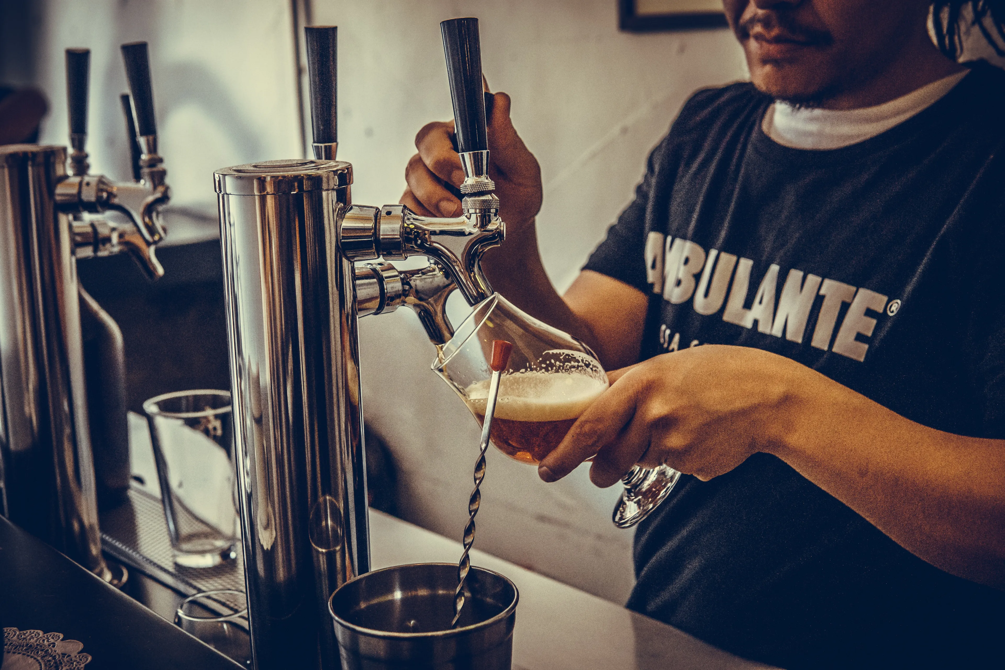 man pouring beer on glass 2216402