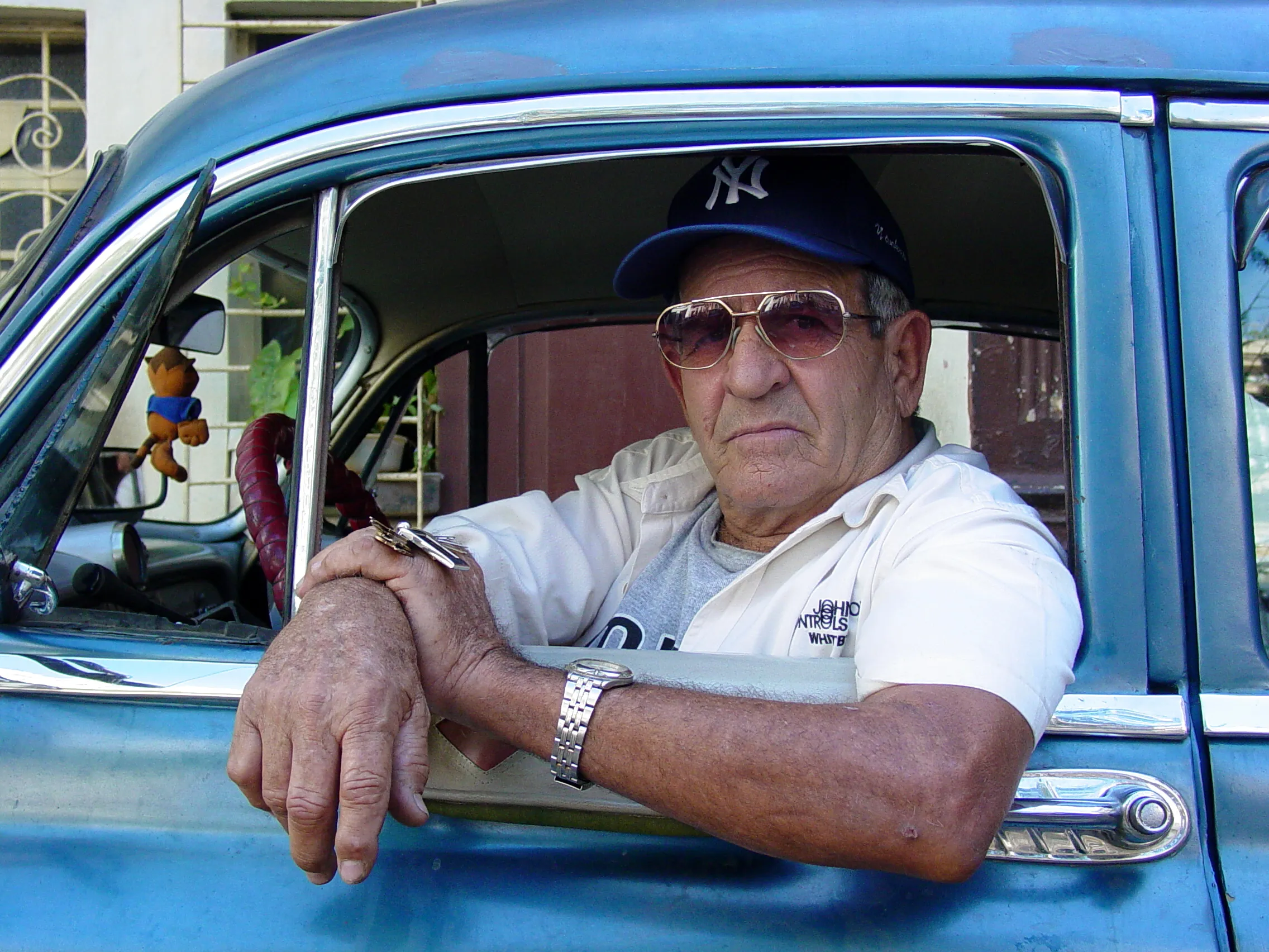 taxi driver in classic car habana vieja havana cuba