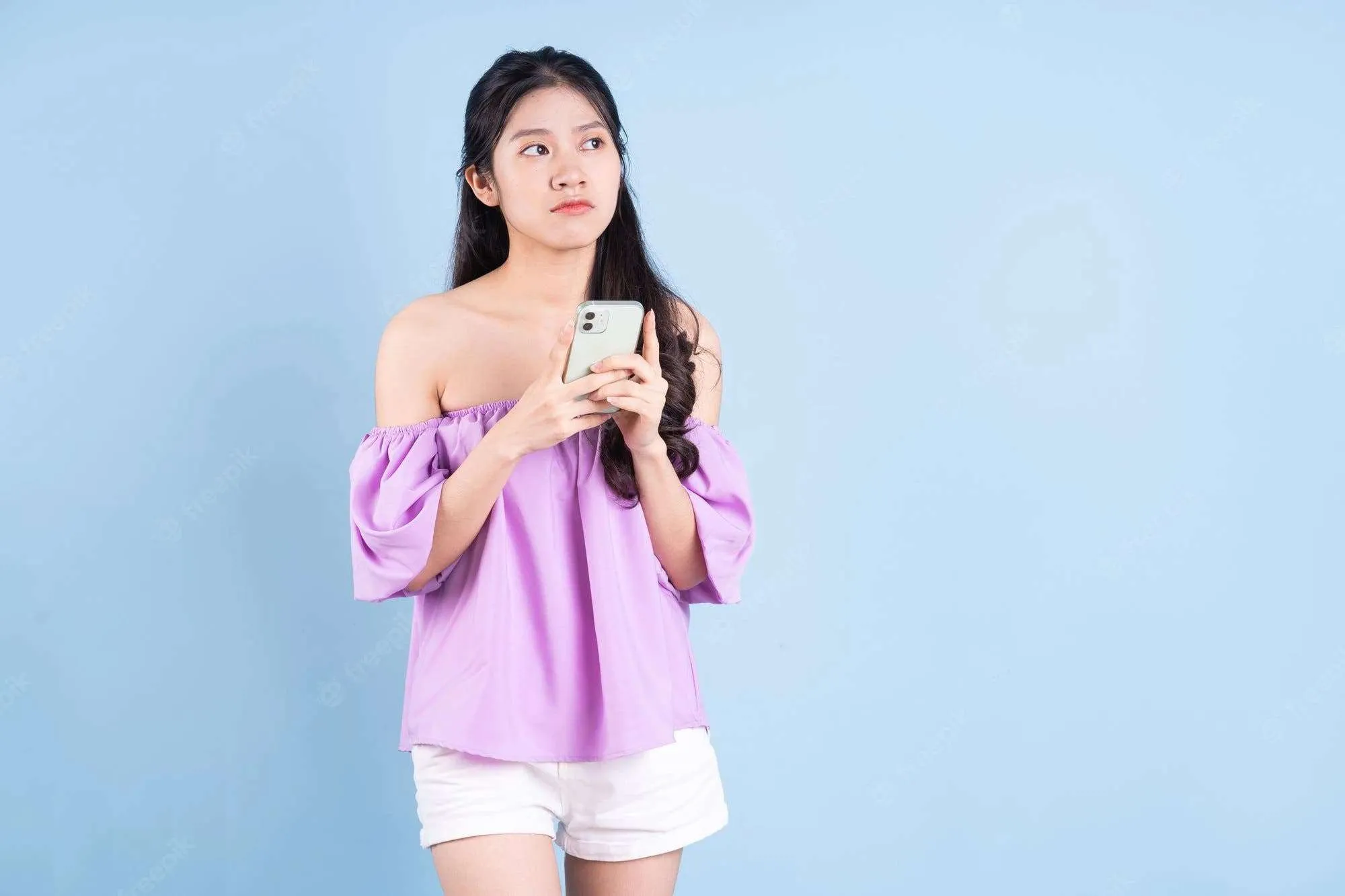 young asian girl using smartphone blue background 296537 3767