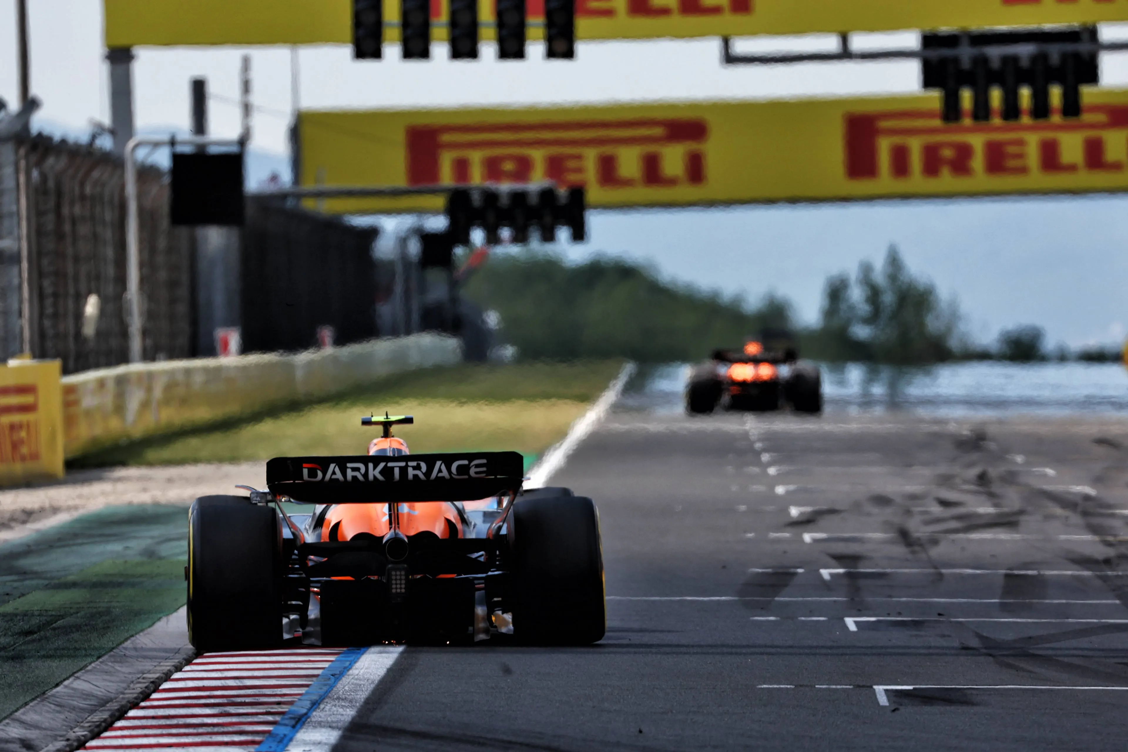 Lando Norris trails Oscar Piastri at the 2024 Hungarian Grand Prix